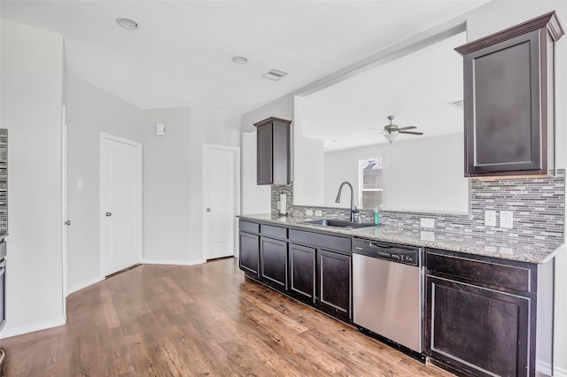 kitchen featuring ceiling fan, sink, stainless steel dishwasher, and light hardwood / wood-style flooring