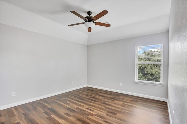 spare room with ceiling fan and dark wood-type flooring