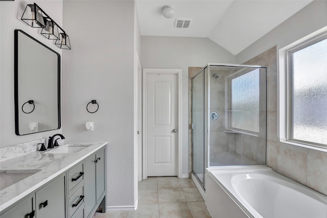 bathroom with plus walk in shower, vanity, tile patterned floors, and lofted ceiling