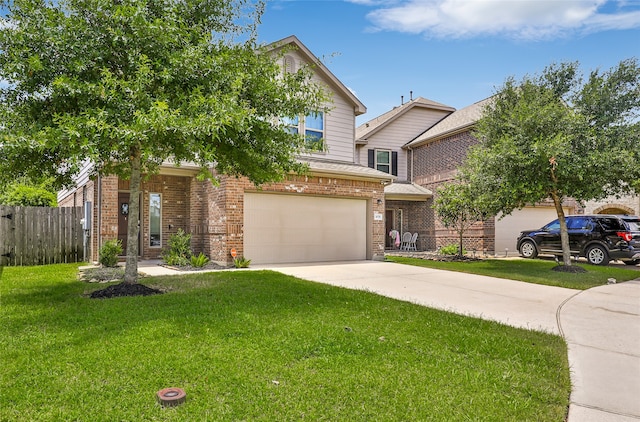 view of front facade with a front yard and a garage