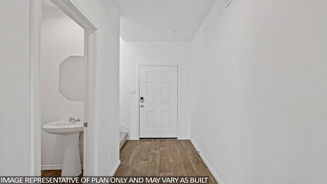 23520 Nectar Crest Hts, Splendora, TX 77372 - hallway with wood finished floors, baseboards, and a sink