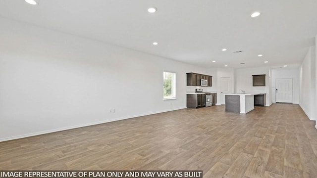 unfurnished living room featuring light hardwood / wood-style flooring