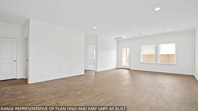 empty room featuring hardwood / wood-style flooring