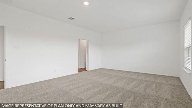 spare room with carpet floors