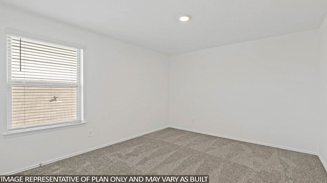 unfurnished room with light carpet