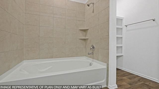 bathroom featuring hardwood / wood-style flooring and tiled shower / bath combo