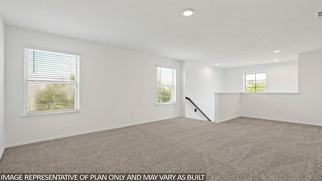 empty room with light colored carpet