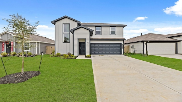 view of front of house with a garage and a front lawn