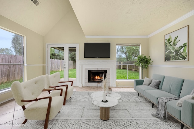 tiled living room featuring a textured ceiling and a wealth of natural light