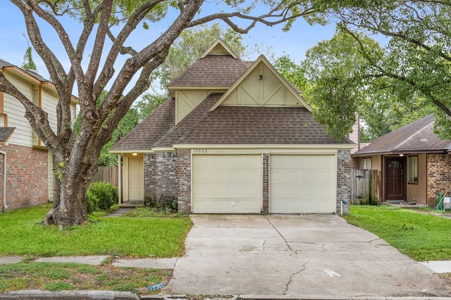 view of front of home with a front yard and a garage