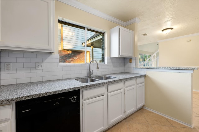 kitchen with white cabinets, dishwasher, decorative backsplash, and sink