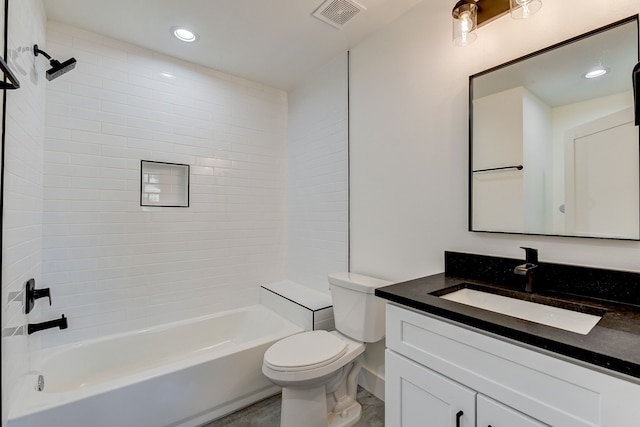 full bathroom with vanity, tiled shower / bath combo, and toilet