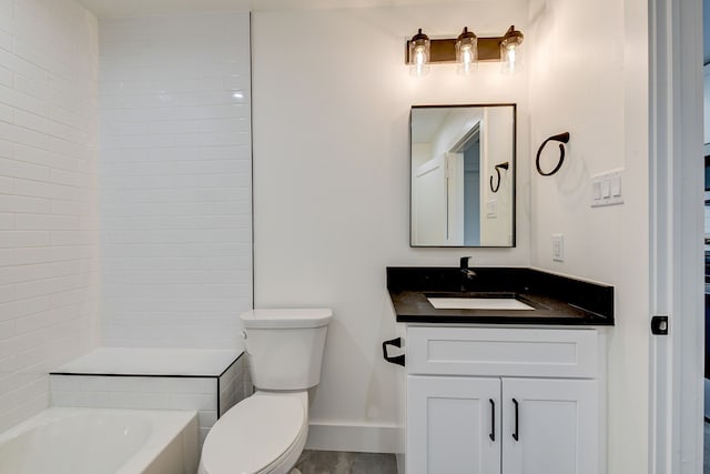 bathroom featuring vanity, toilet, and a bath