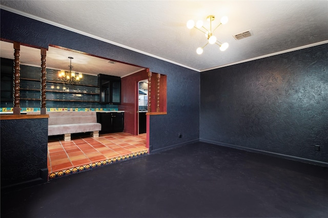 bar with a textured ceiling, a notable chandelier, crown molding, and concrete floors