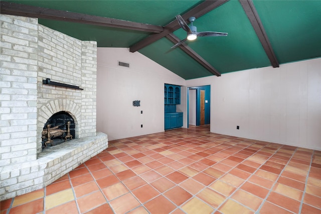 unfurnished living room with tile patterned flooring, vaulted ceiling with beams, ceiling fan, and a fireplace