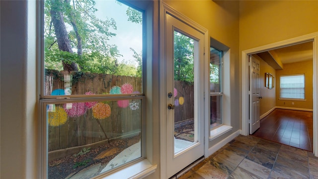 doorway to outside featuring wood-type flooring