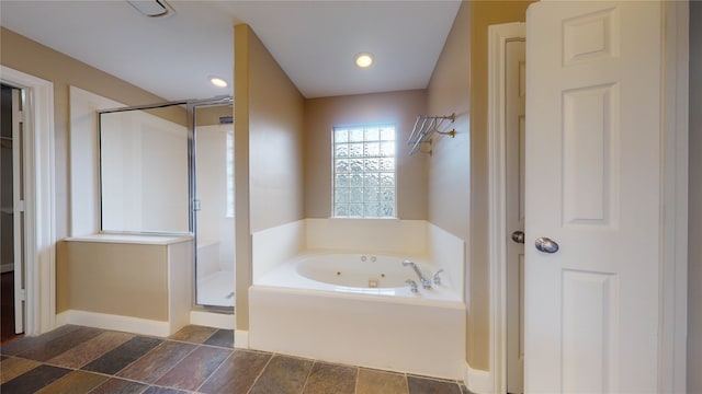 bathroom with separate shower and tub