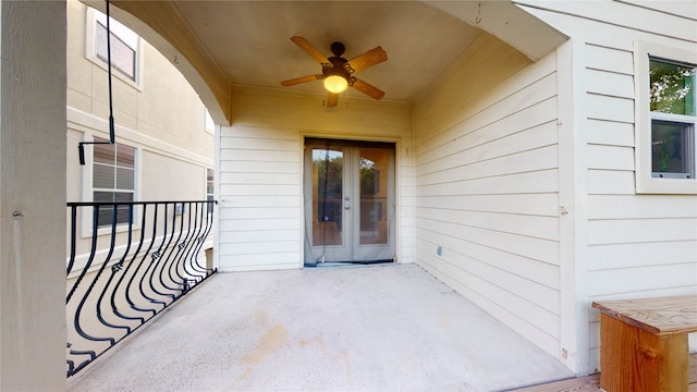 view of exterior entry with french doors and ceiling fan