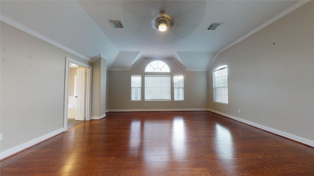 spare room with ceiling fan, dark hardwood / wood-style flooring, crown molding, and vaulted ceiling