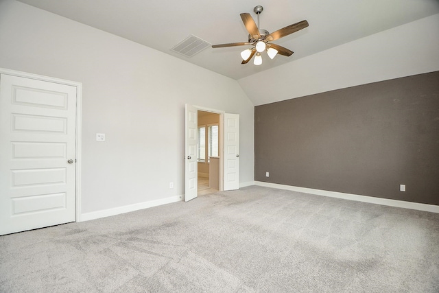 unfurnished bedroom featuring carpet, ceiling fan, and lofted ceiling