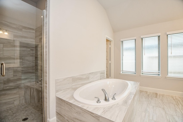 bathroom featuring plus walk in shower and vaulted ceiling