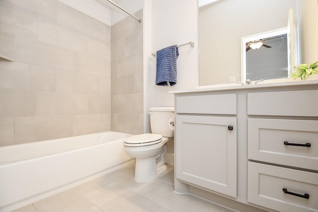 full bathroom with tile patterned floors, vanity, ceiling fan, toilet, and tiled shower / bath