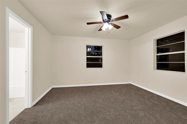 empty room with carpet flooring and ceiling fan