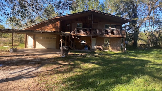 view of front of home featuring a garage, a deck, and a front yard