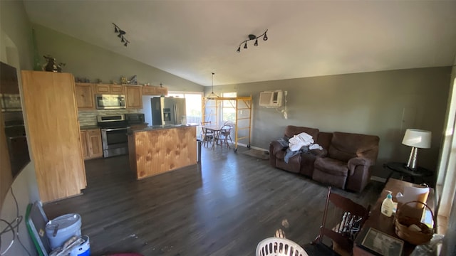 living room featuring a wall mounted air conditioner, dark hardwood / wood-style flooring, track lighting, and lofted ceiling