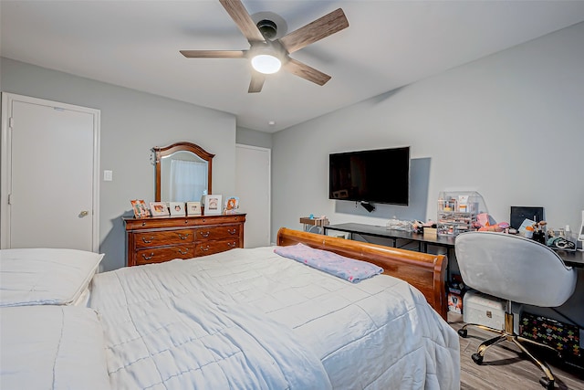 bedroom featuring light hardwood / wood-style flooring and ceiling fan