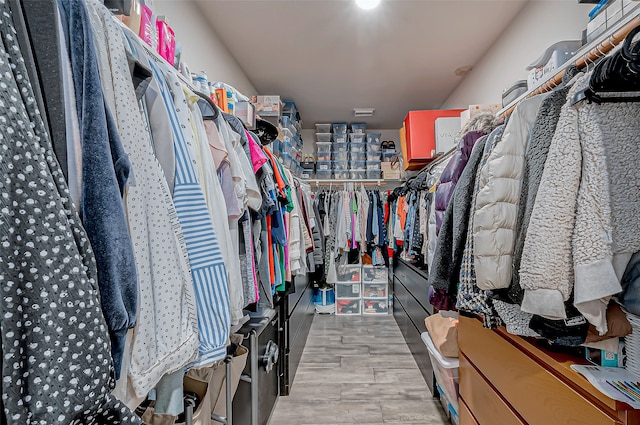 walk in closet featuring light hardwood / wood-style floors