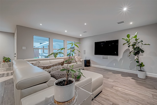 living room with light hardwood / wood-style flooring