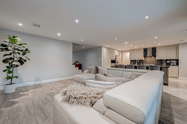 living room with light hardwood / wood-style flooring