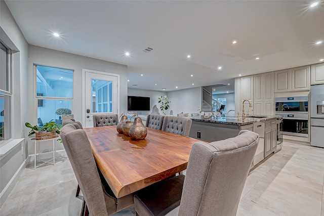 dining area featuring sink