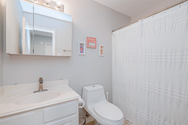 bathroom featuring vanity and toilet