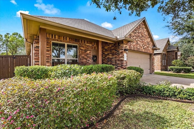 ranch-style home featuring a garage