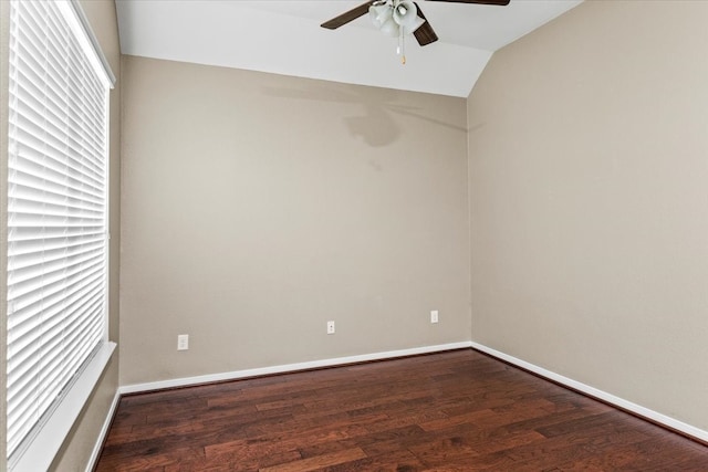 unfurnished room with ceiling fan, dark hardwood / wood-style floors, and vaulted ceiling