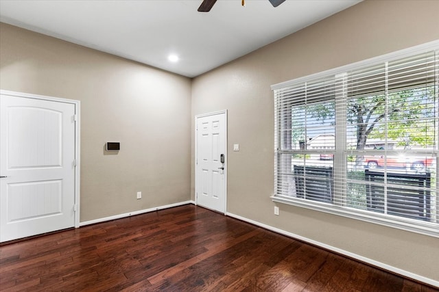 foyer entrance featuring ceiling fan and dark hardwood / wood-style floors