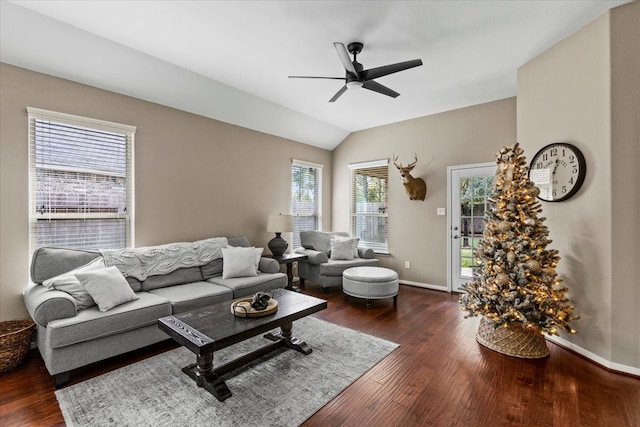 living room with ceiling fan, dark hardwood / wood-style flooring, and vaulted ceiling