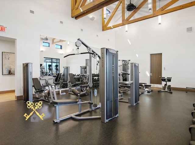 workout area with a high ceiling