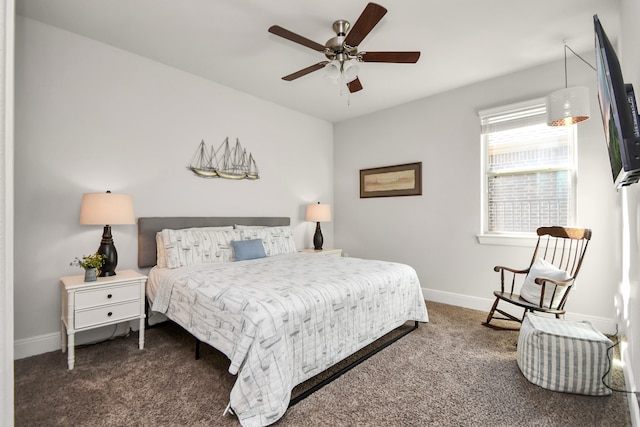 bedroom with dark colored carpet and ceiling fan