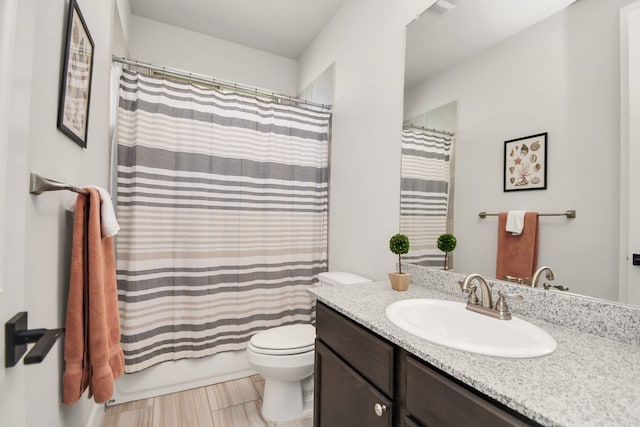 full bathroom with tile patterned floors, vanity, shower / bath combination with curtain, and toilet