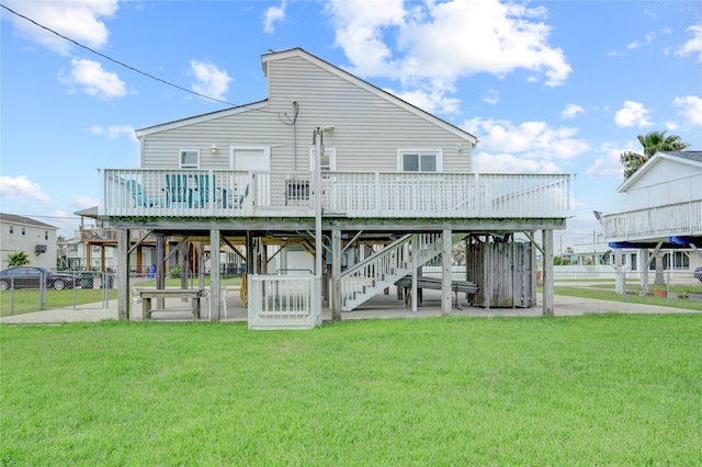 rear view of property with a lawn and a deck