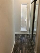 hallway featuring dark wood-type flooring