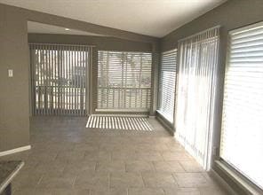 unfurnished sunroom featuring plenty of natural light