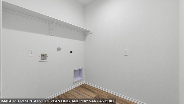 washroom featuring hardwood / wood-style flooring, hookup for an electric dryer, gas dryer hookup, and hookup for a washing machine