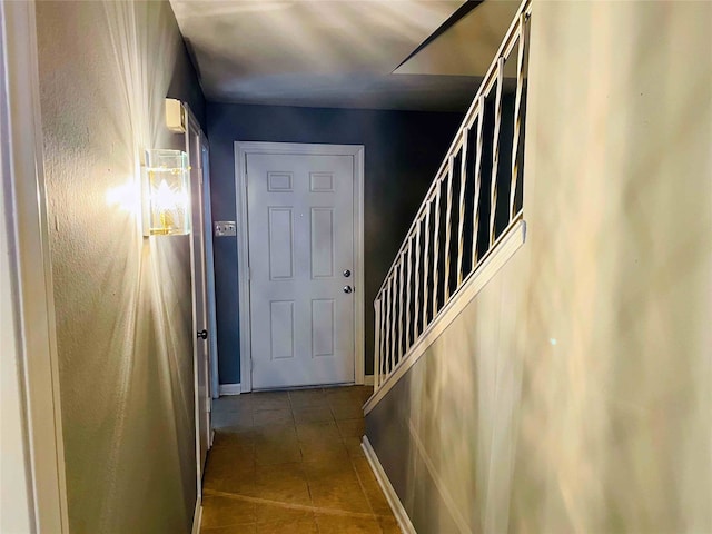 stairway featuring tile patterned floors