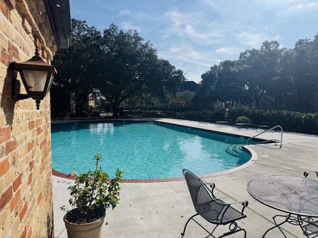 view of pool featuring a patio