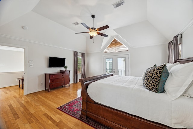 bedroom featuring ceiling fan, french doors, light hardwood / wood-style floors, vaulted ceiling, and access to outside