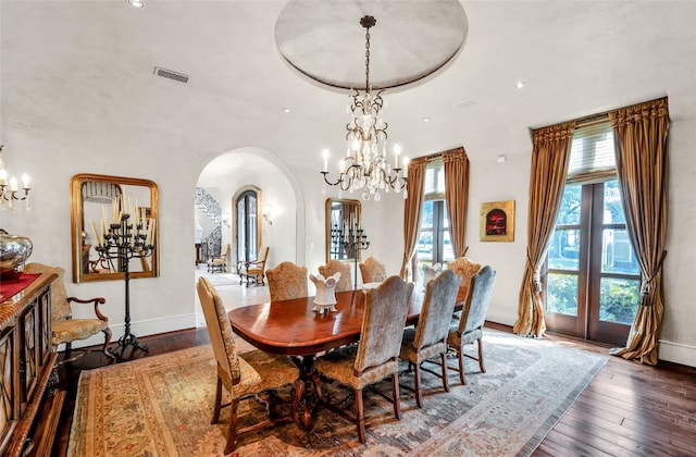 dining room featuring french doors and dark hardwood / wood-style floors